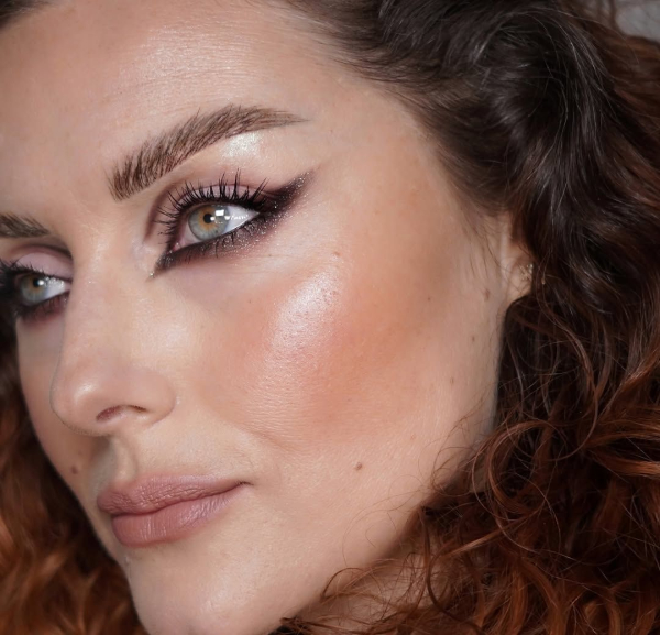 Makeup artist Katie Jane Hughes wearing sparkly blush