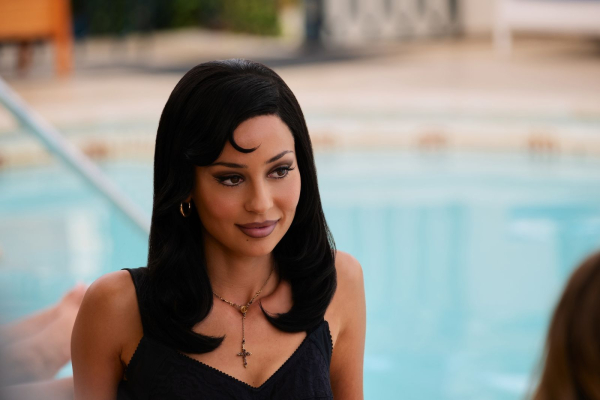 Actress Alexa Demie as Maddy in Euphoria season 3 sitting in front of a pool.