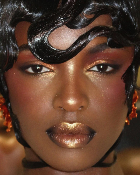 Gold lipstick on Black model